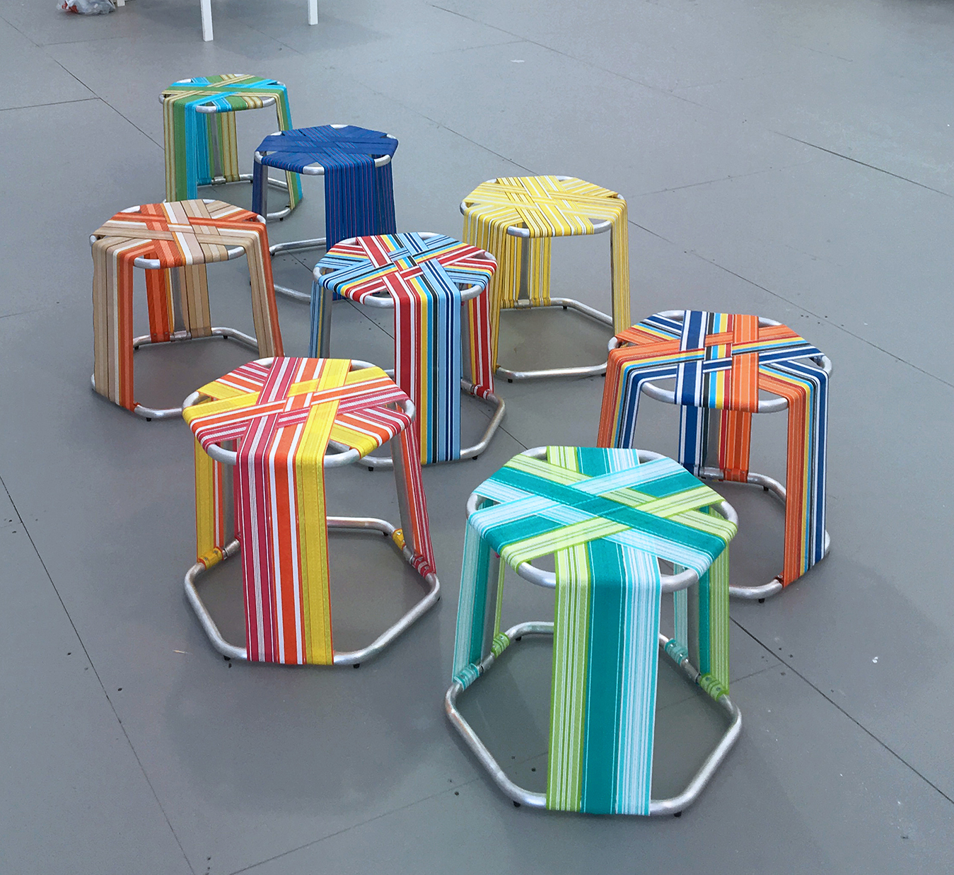 AMLgMATD, WEBSTR Stools, 2018, aluminum tubing, polypropylene webbing, zinc-plated screws, rubber feet, dimensions variable. 
Photo credit: AMLgMATD