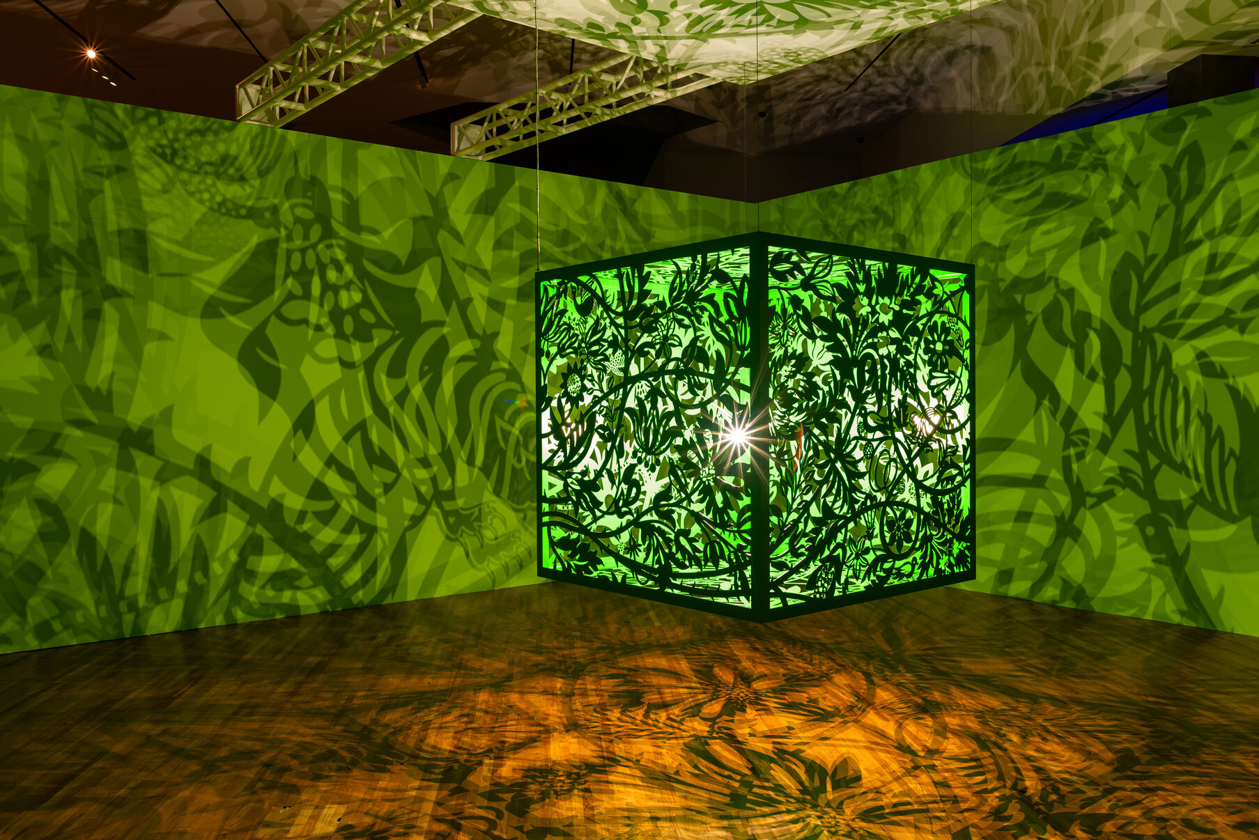 Anila Quayyum Agha, A Thousand Silent Moments (Rain Forest), 2024. Laser-cut resin-coated aluminum, Light Bulb. Lacquered steel and LED bulbs. Commissioned by the Aga Khan Museum. Photography Credit: Aly Manji.