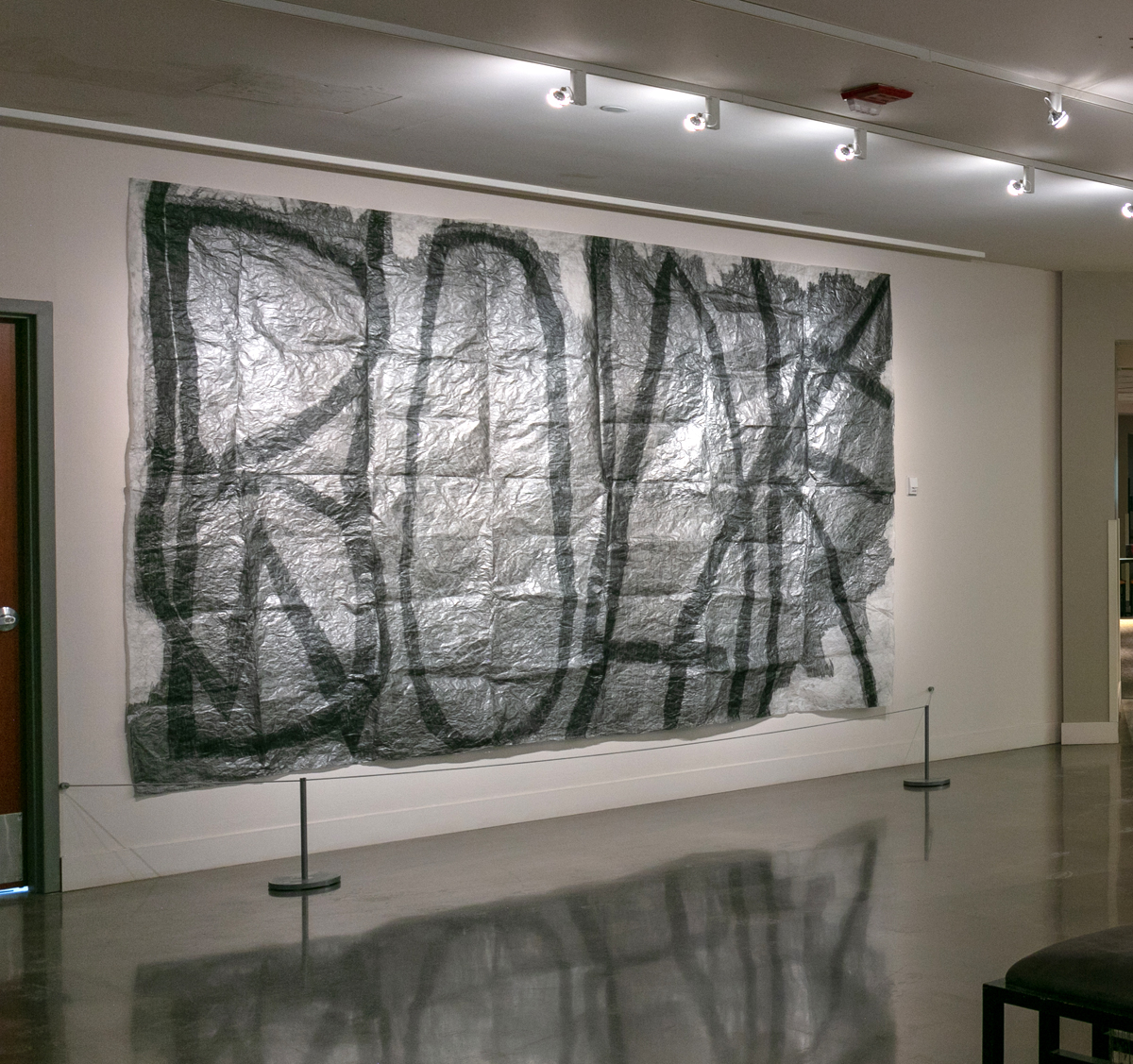 Masha Sha, Homo Homini Lupus (2021), graphite and black lead on tracing paper, 8 x 12 feet